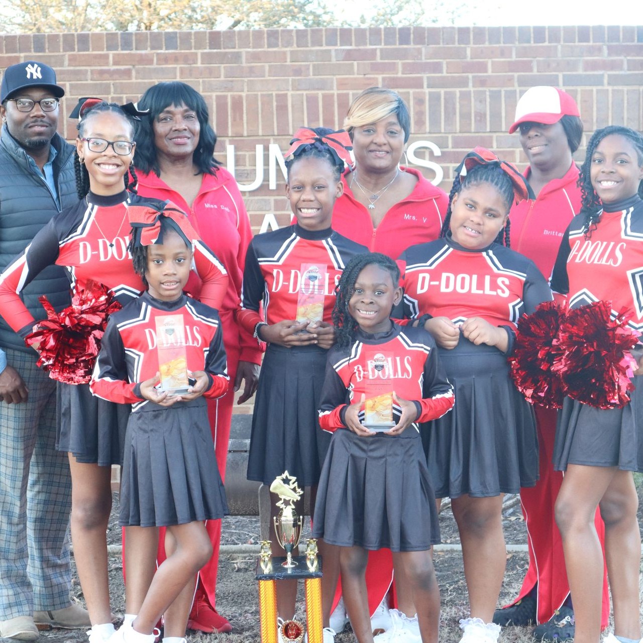 Cheer dance team group photo with coaches